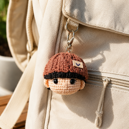 Handmade WoolyArtis K-Pop inspired crochet doll keychain set with cute amigurumi mini plush charms for fans and accessories.