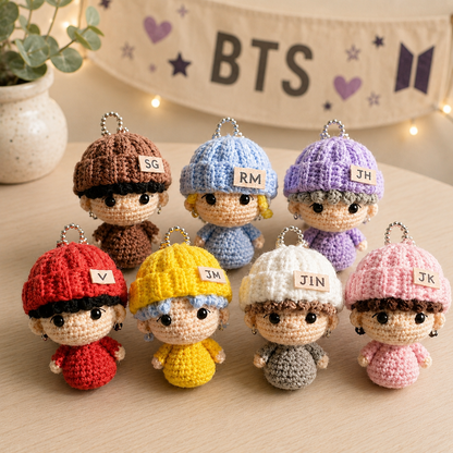 Handmade WoolyArtis K-Pop crochet doll keychain set with cute amigurumi mini plush charms featuring fan-made member designs.