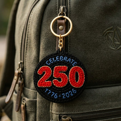 WoolyArtis WoolyArtis 250th USA anniversary keychain with red, white, and blue patriotic crochet-style design and 1776-2026 marking
