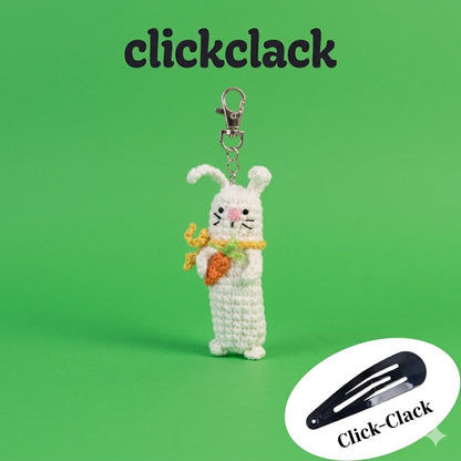 Handmade crochet sensory fidget keychain with bunny, carrot, and pickle designs, featuring satisfying click-clack sounds for stress relief.