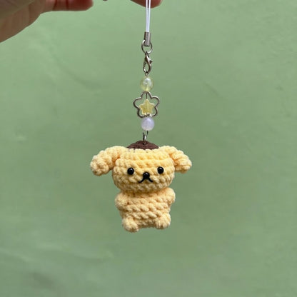 Handmade WoolyArtis crochet Hello Kitty keychain with plush amigurumi design attached to a keyring.