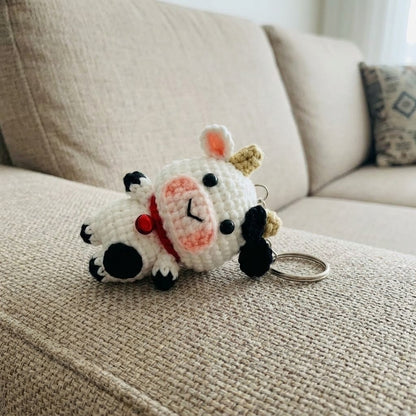 Crochet cow keychain by WoolyArtis, adorable amigurumi plush farm animal, cute kawaii cow bag charm for backpacks or purses