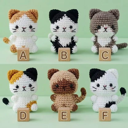 WoolyArtis Tiny Crochet Cat Plushie keychain charm, handmade amigurumi kitten with detailed crochet features, attached to a keyring.