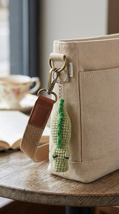 WoolyArtis Crochet Crocodile Fidget Toy keychain featuring a cute amigurumi design, tactile stress relief, and click-clack sounds.