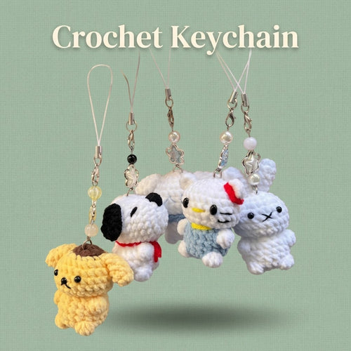 Handmade WoolyArtis Crochet Hello Kitty keychain with plush amigurumi design, perfect as a cute bag charm or accessory.